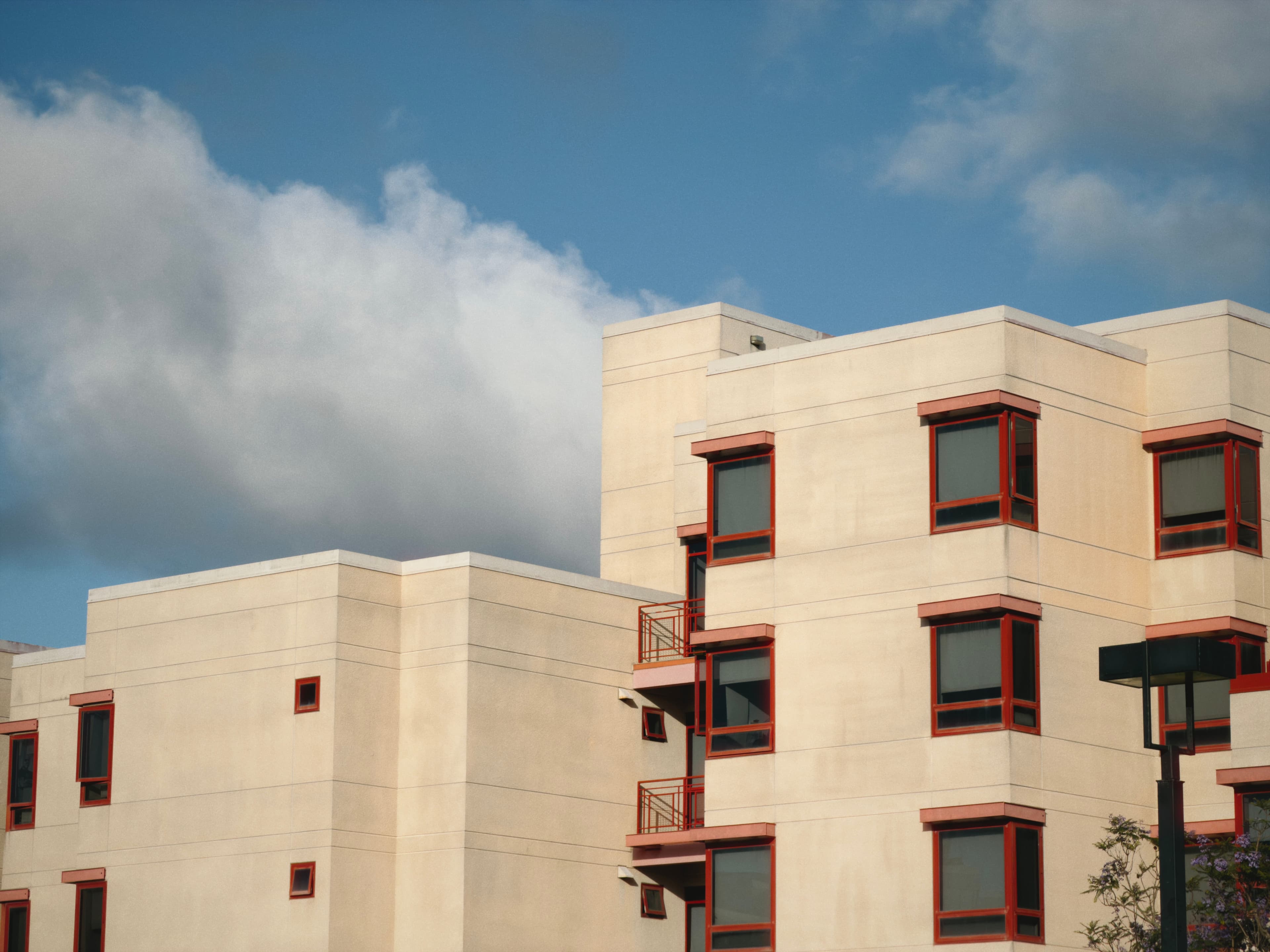 some buildings against a blue sky w/clouds